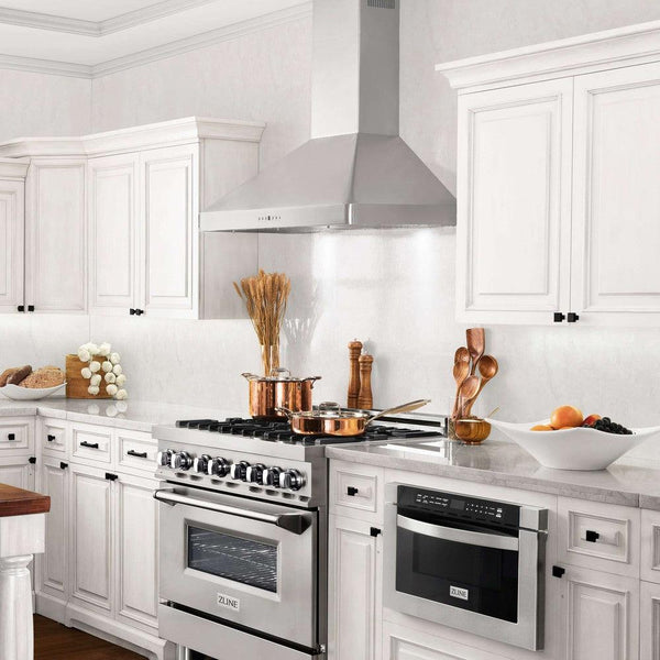 ZLINE Convertible Vent Wall Mount Range Hood in Stainless Steel (KF2) lifestyle, in a farmhouse-style kitchen from side.